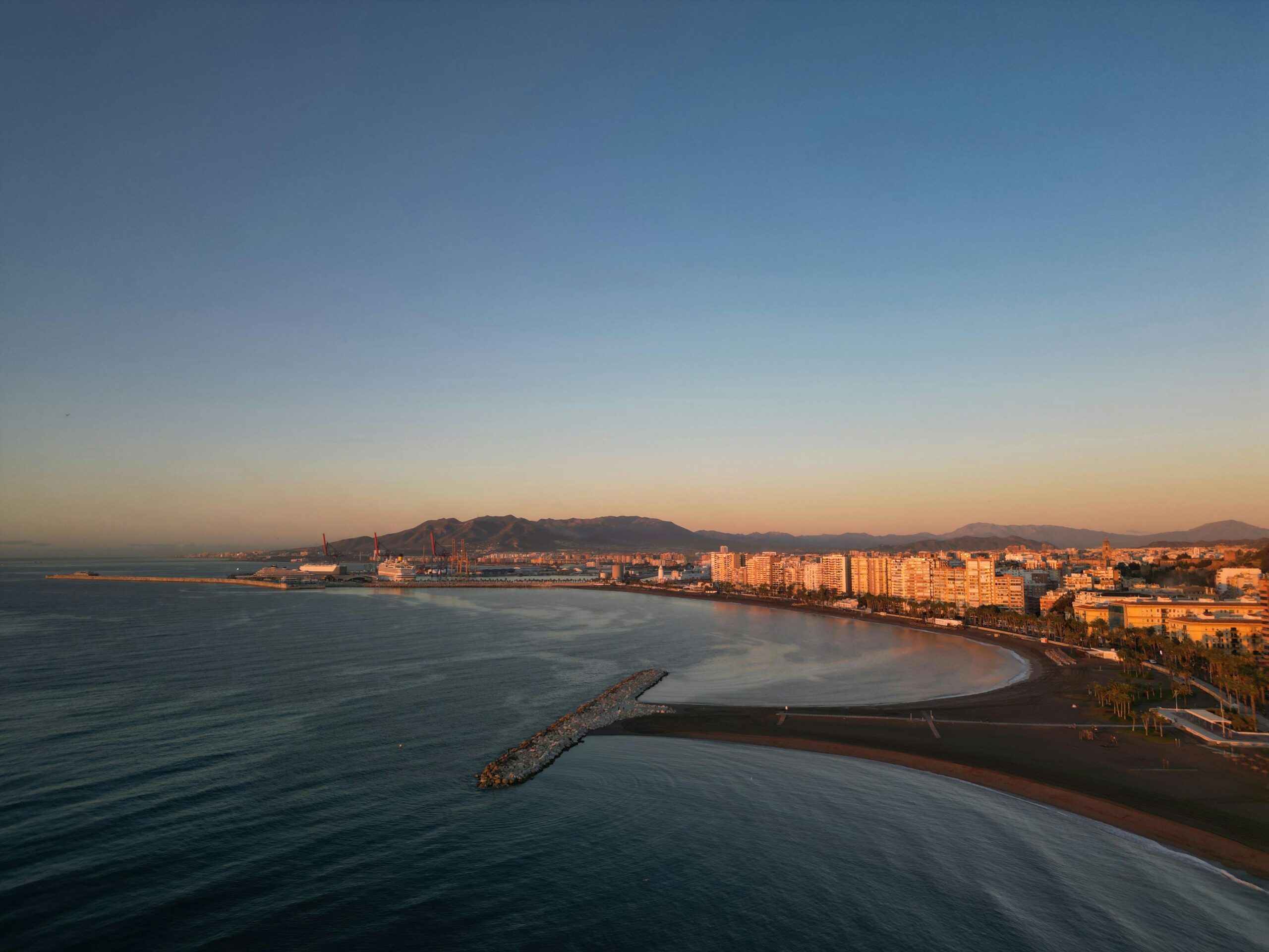 City on Sea Coast at Sunset